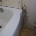 How do you know if there is water behind a wall?